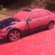 A car covered in aerially-applied fire retardant. (AP/Matt Hartman)